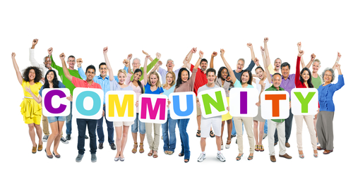 People holding a community sign